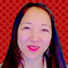 headshot of Jolene Jang, adult woman with long dark hair, fair skin and crescent shaped eyes, a fourth-generation American with Japanese, Chinese, and Swedish ancestors