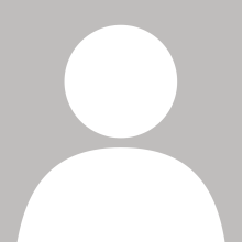 white generic person icon against a grey background